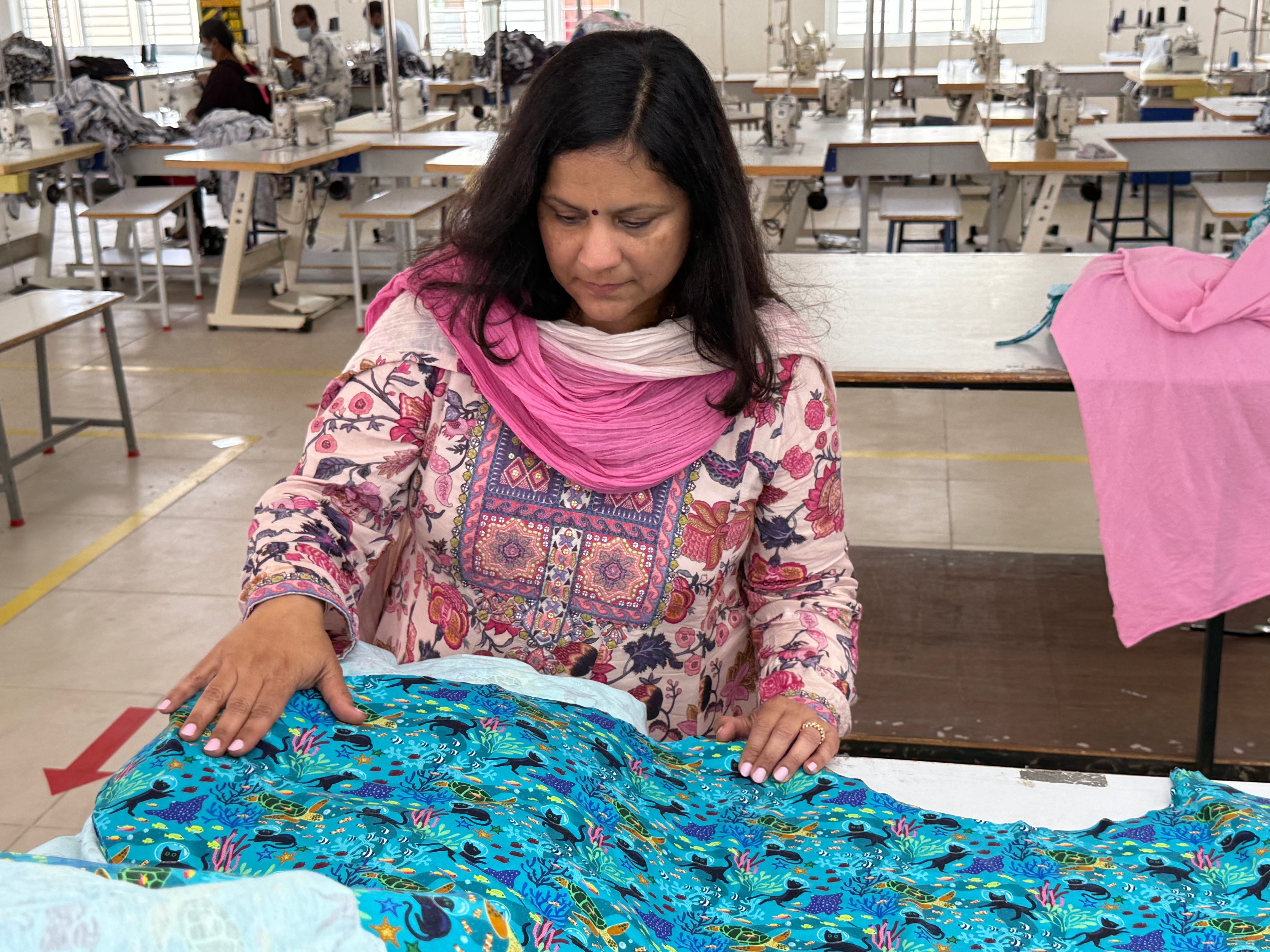 Jaya Iyer is inspecting the production of the Seabed Exploration print dress.